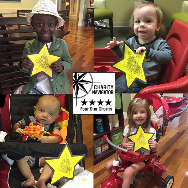 four children holding stars